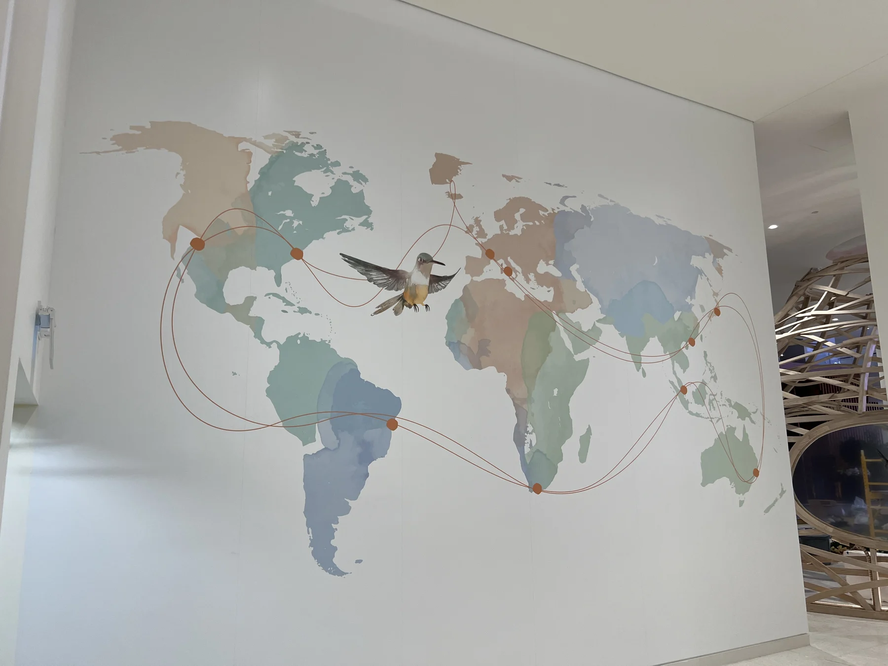 Completed floor-to-ceiling world map wall graphic at Oakridge